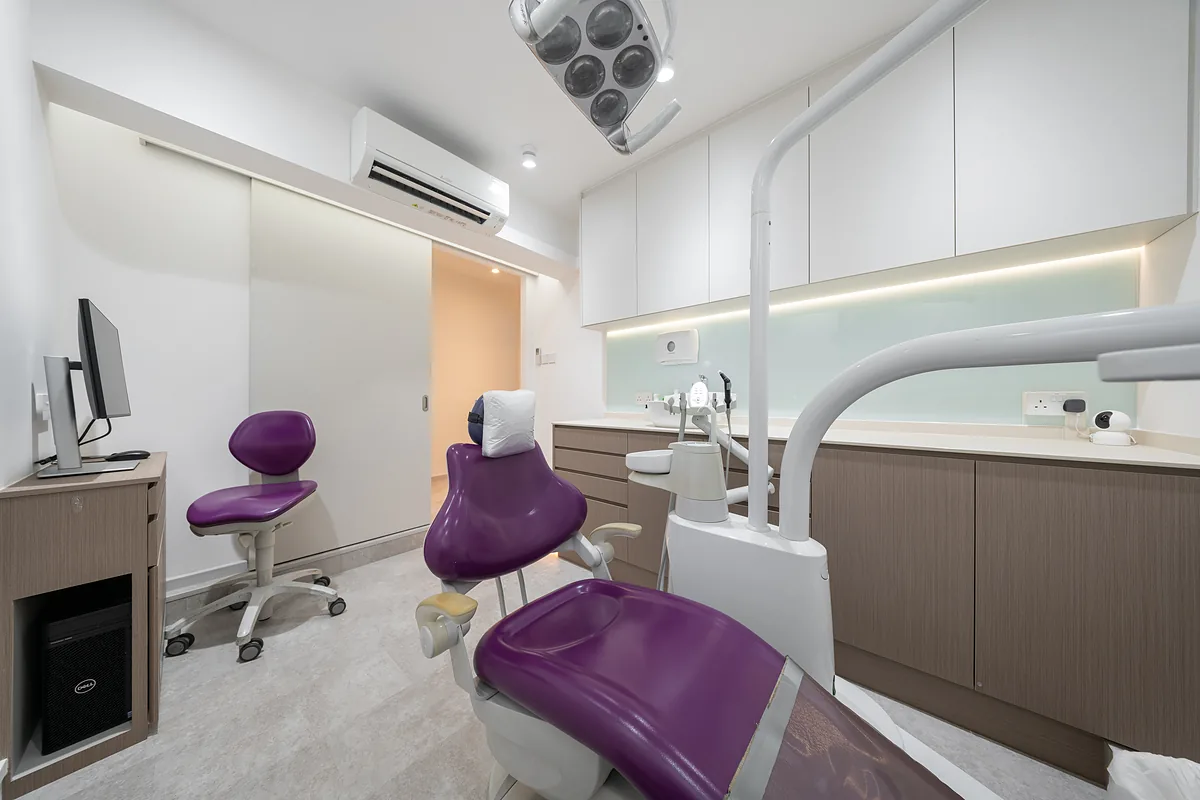 Dental treatment room with a purple dental chair at True Dental Studio in Ang Mo Kio.