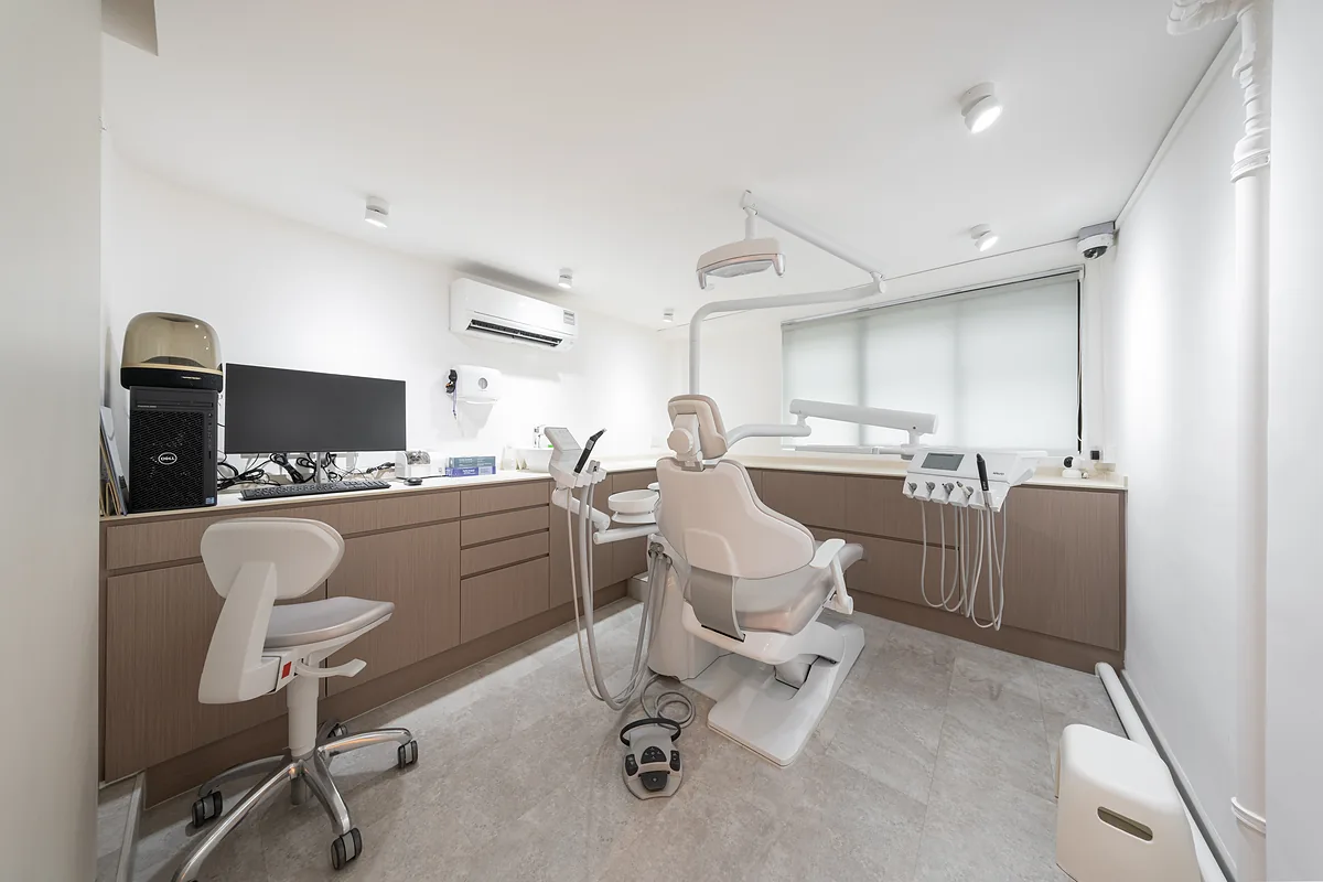 Second dental treatment room with a dental chair and equipment at True Dental Studio, Ang Mo Kio.