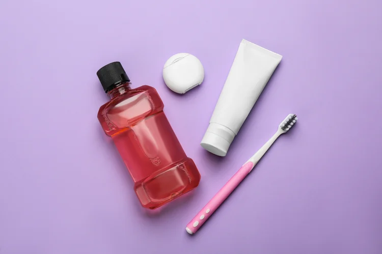 Toothbrush, toothpaste, mouthwash, and dental floss for oral hygiene to prevent plaque buildup and reduce risk of gum disease.