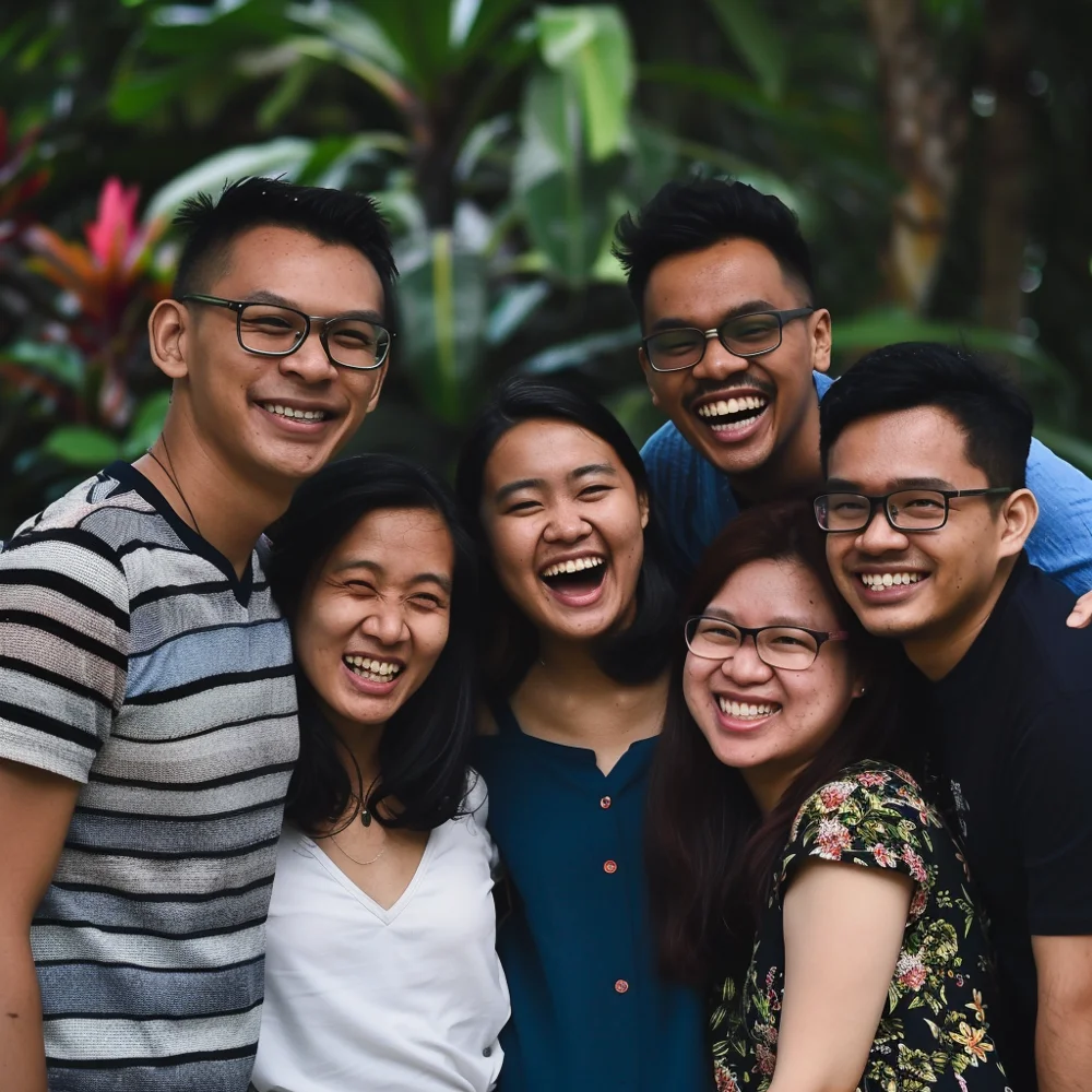 Young asians who go for regular dental check-ups smiling widely at the camera.